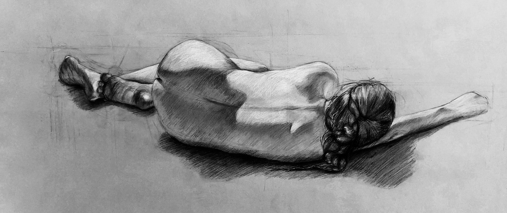 life drawing in charcoal of a woman lying on her side, by Hannah Kim
