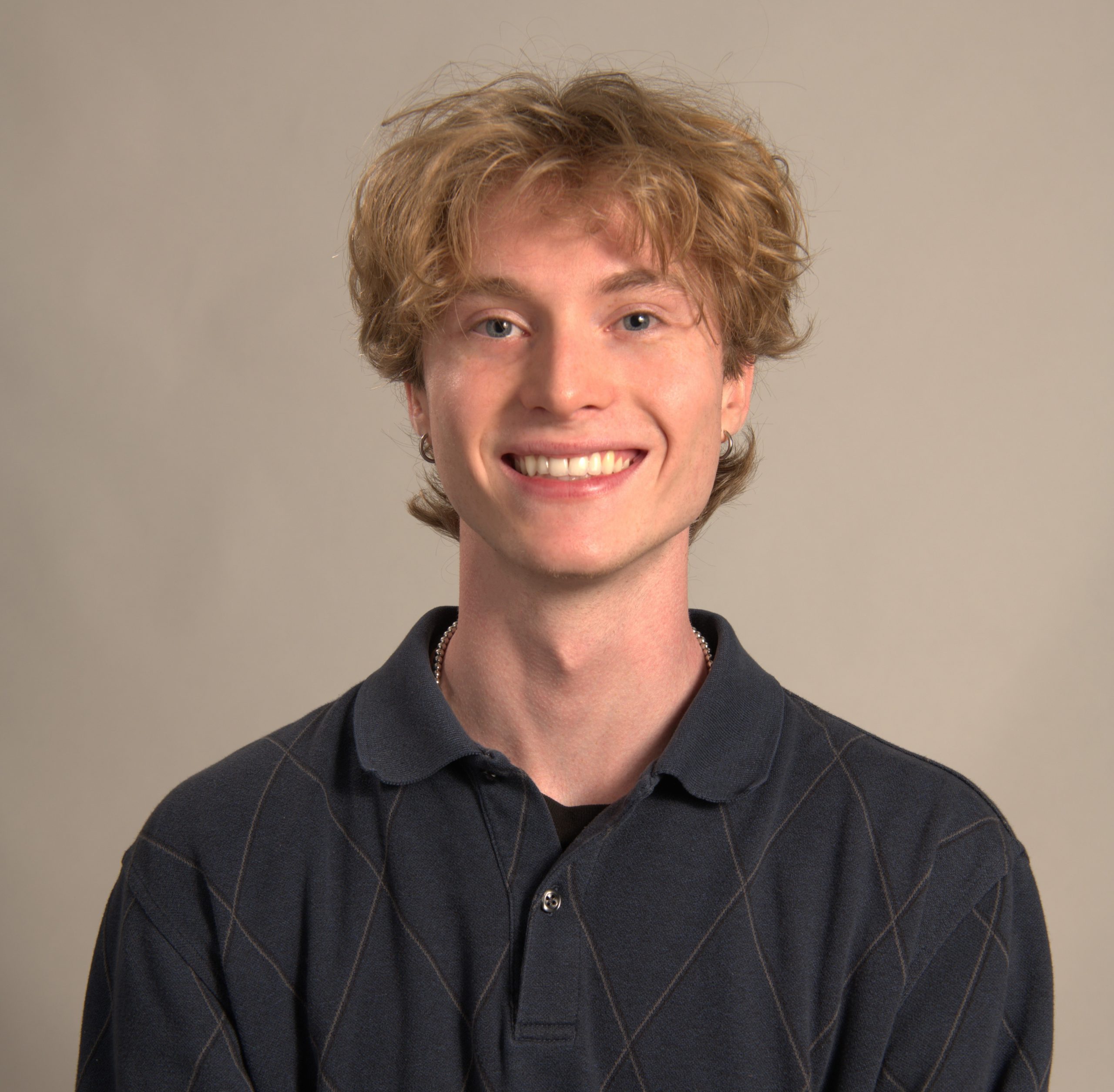 Blonde man smiles